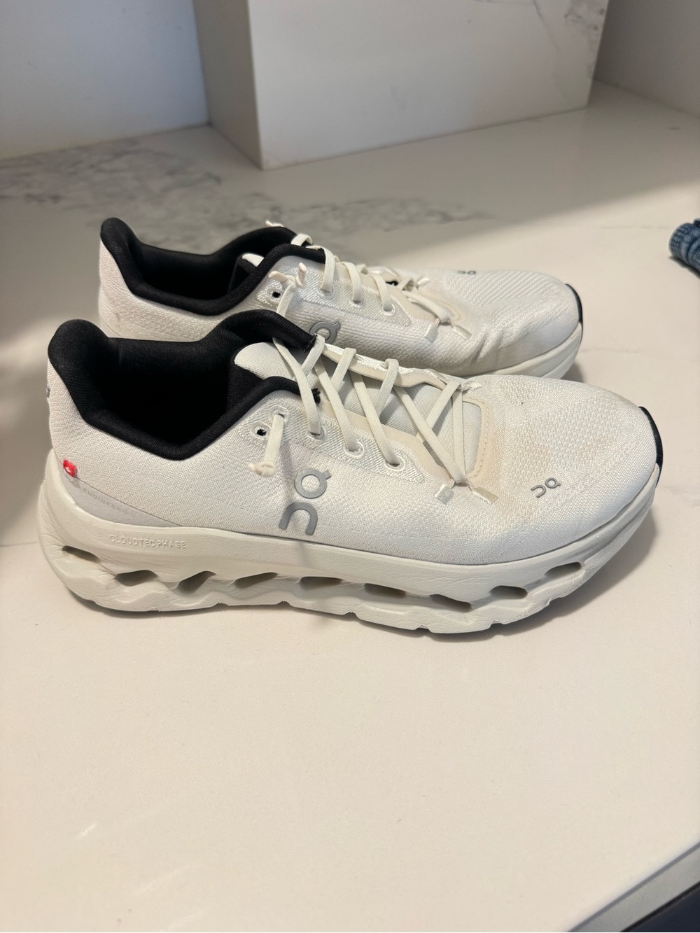 On Women's Cloudmonster White and Black Running Shoes